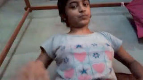 A young female student using her voice while pleasuring herself in school