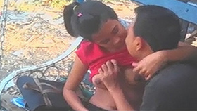 Desi boyfriend fondles his girlfriend's large breasts on a park bench