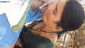 Indian aunt gives oral pleasure in the woods during a picnic