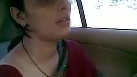 An Indian mother from Gujarat gets intimate in a car, showcasing her nipples