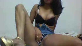 Aroused South Asian woman pleasuring herself on camera