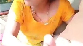 A seductive blonde gives a sensual oral pleasure in a car