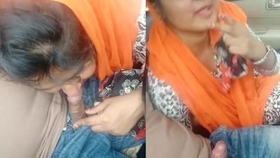 South Asian woman gives oral pleasure to a man in a vehicle