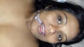 A girl engages in oral sex, intercourse, and receives a facial cumshot