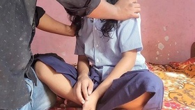 A South Asian girl returns from school and engages in sexual activity with her male companion