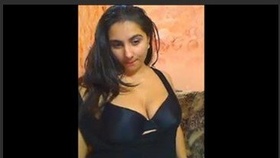 A voluptuous woman indulges in self-pleasure on webcam