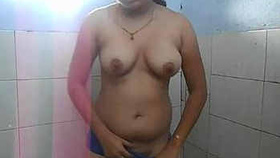 Indian girl displays herself while pleasuring herself in the restroom