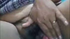 Aroused Indian aunt moistly stimulates her genitalia with her fingers