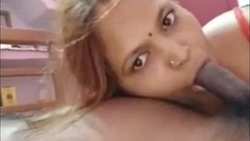 An Indian aunt seductively performs oral sex
