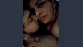 A seductive Indian wife passionately kisses and engages in sexual intercourse with her husband's penis