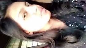 Young live-streaming performer records a video for her boyfriend