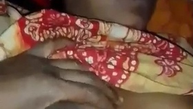 Husband squeezes his wife's breasts in Indian style