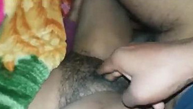 Indian wife's hairy private parts are being pleasured and penetrated by her spouse