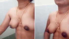Naked Desi aunty with sexy glasses shows hairy armpits in the shower