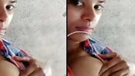 Attractive indian girl lies on the bed and even flashes her XXX boobs
