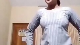 Desi bhabi unbuttoning her dress
