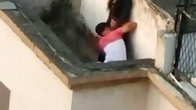 Young lover having sex on the roof, captured